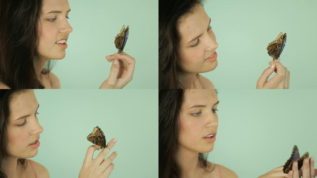 蓝色蝴蝶的美女亲近自然蝴蝶停留在手指上