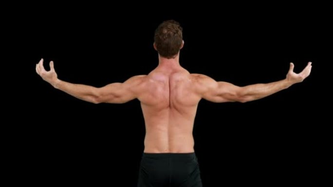 肌肉发达的人伸出双臂的后视图