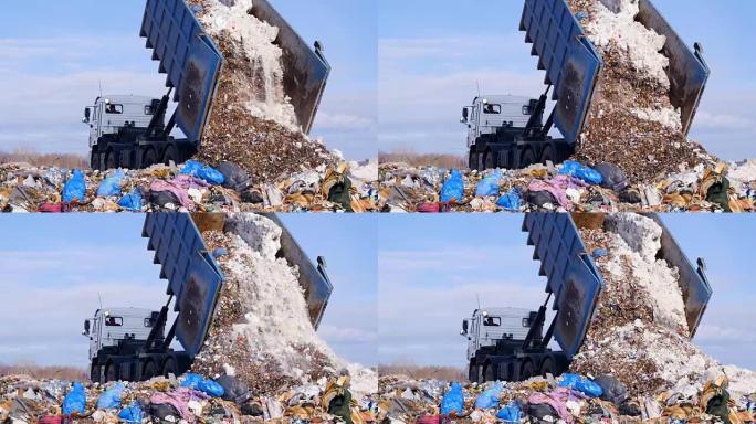 4K.卡车将废物卸载到一个巨大的垃圾填埋场。