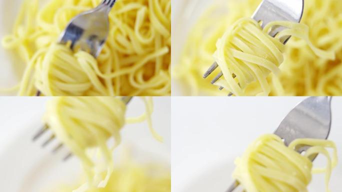 叉子上煮熟的意大利面的特写