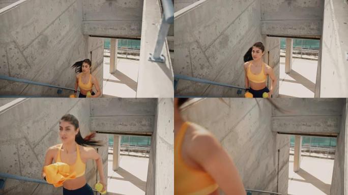 \ 年轻女运动员在城市体育场楼梯上锻炼和奔跑