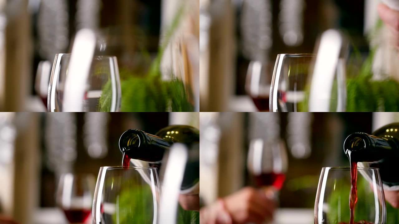 侍酒师在餐厅里用葡萄酒填充杯子