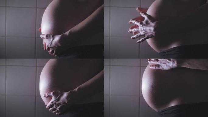一个女人怀孕肚子的特写镜头。