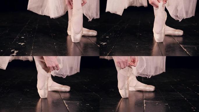 女舞者穿上芭蕾舞鞋