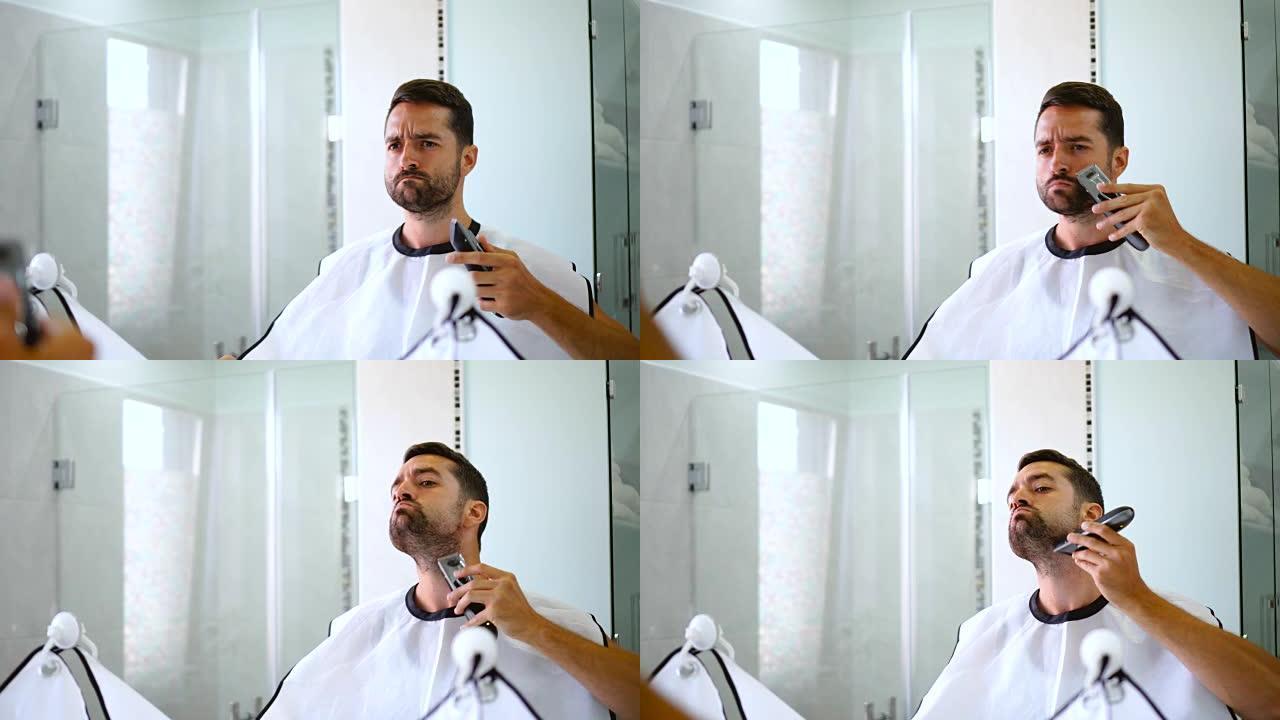 男人用修剪器刮胡子