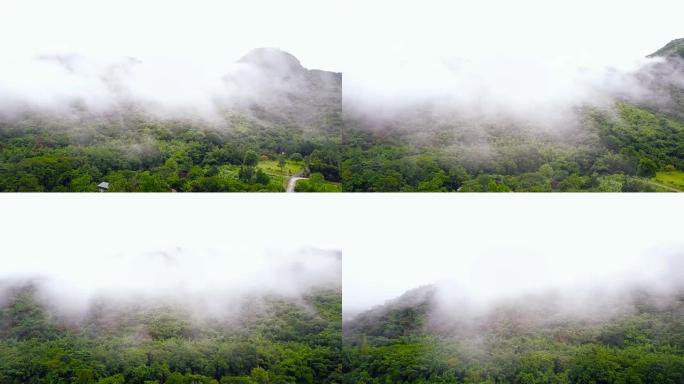在泰国Ratchaburi省，4k空中拍摄的雾气滚过山脉。