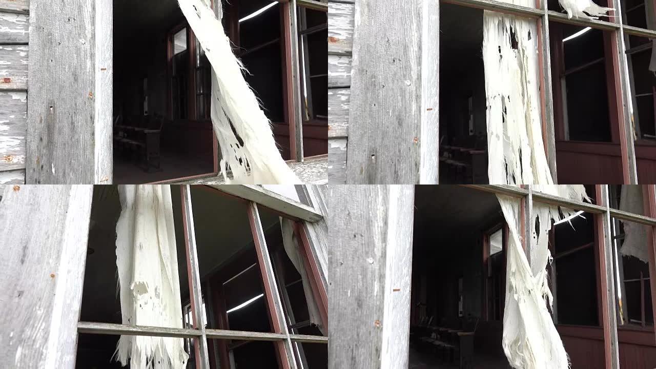 特写: 透过窗户看着破旧的鬼屋的教室