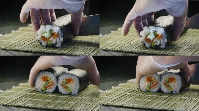 专业厨师正在日本餐厅切寿司卷