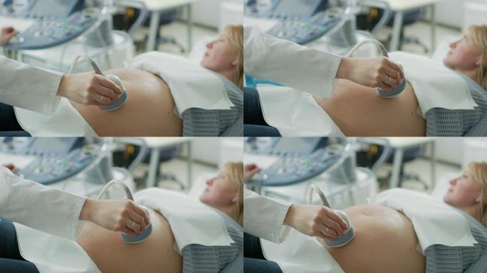 在医院中，使用换能器对产科医生进行高角度拍摄，以进行超声/超声检查/扫描孕妇的腹部。
