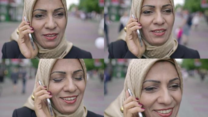 中年阿拉伯妇女在电话中交谈