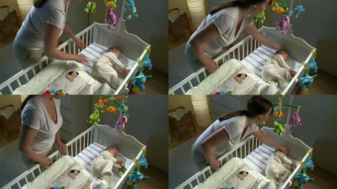 HD起重机: 母亲在婴儿床中抚摸婴儿