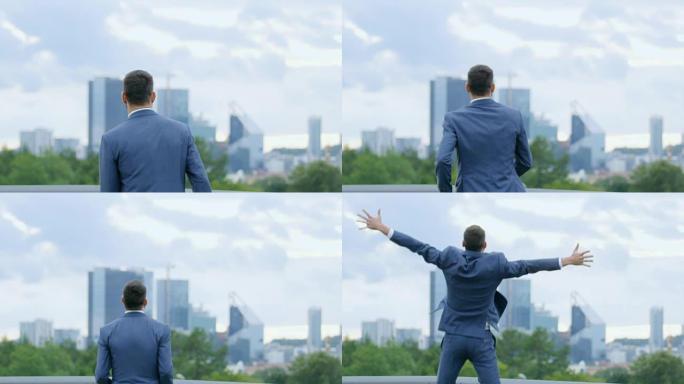 快乐成功的商人张开双手跳跃，他有自己的商业胜利。背景是有摩天大楼的大城市。