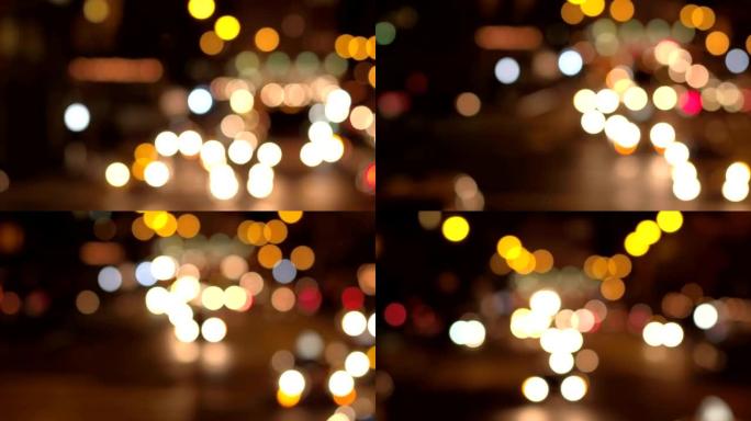 BOKEH: 市区五颜六色的模糊交通信号灯和汽车大灯