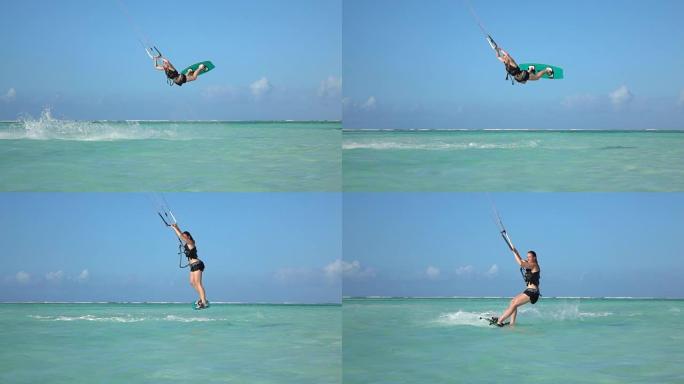 慢镜头特写:极限风筝女孩风筝板跳跃拉力赛在蓝色泻湖