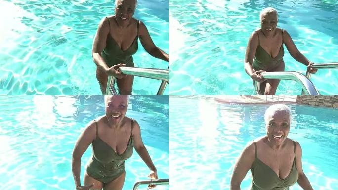 高级非裔美国妇女爬出游泳池