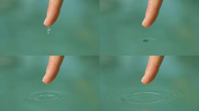 慢动作: 小水滴从女人的指尖滑入游泳池。