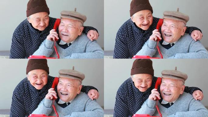 开心的爷爷奶奶在电话里聊天