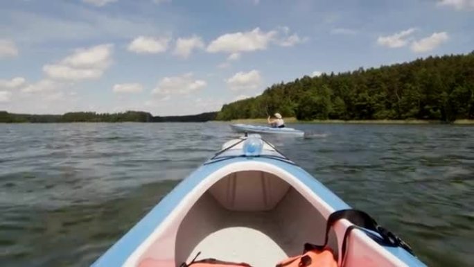 Summer relaxing activity. Friends kayaking on the 