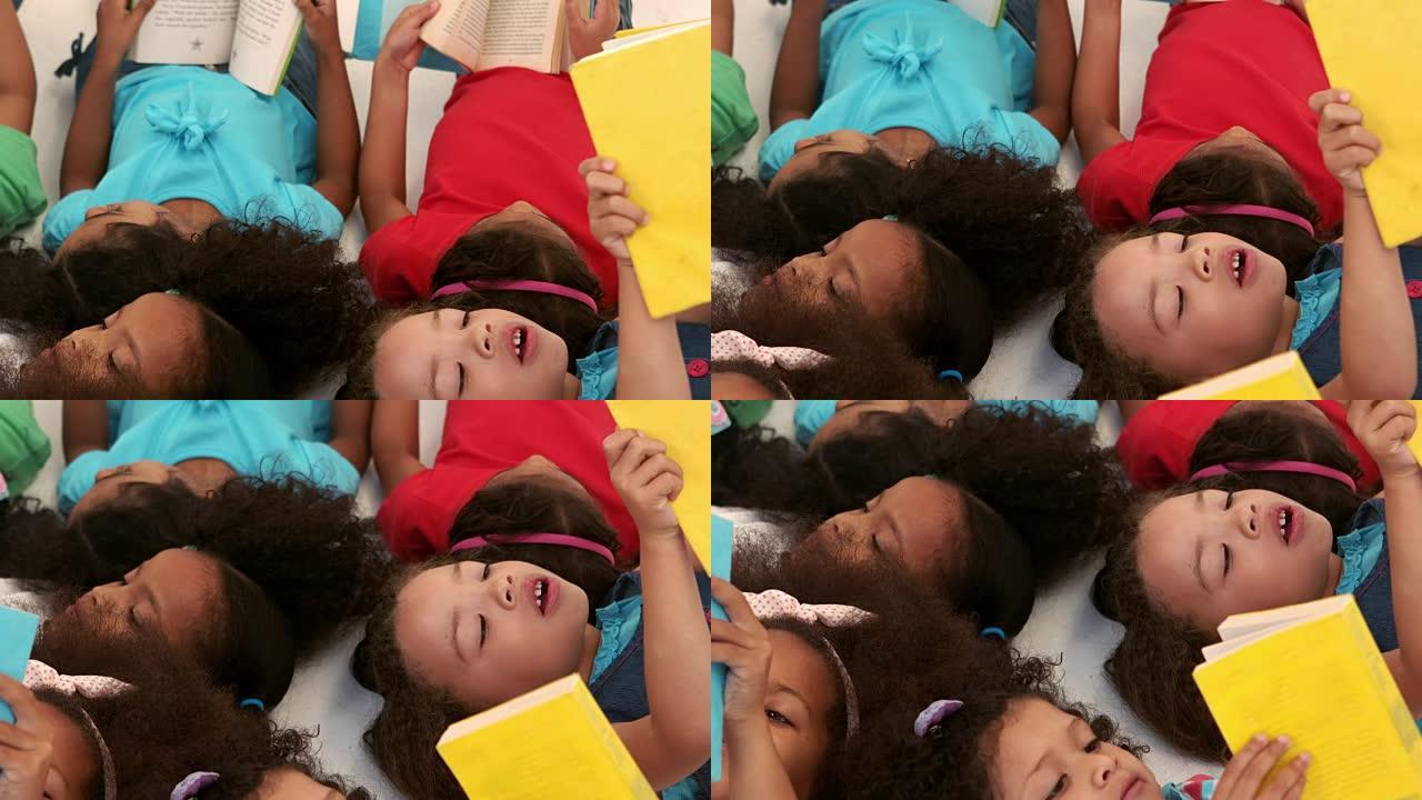 一小群孩子躺着看书