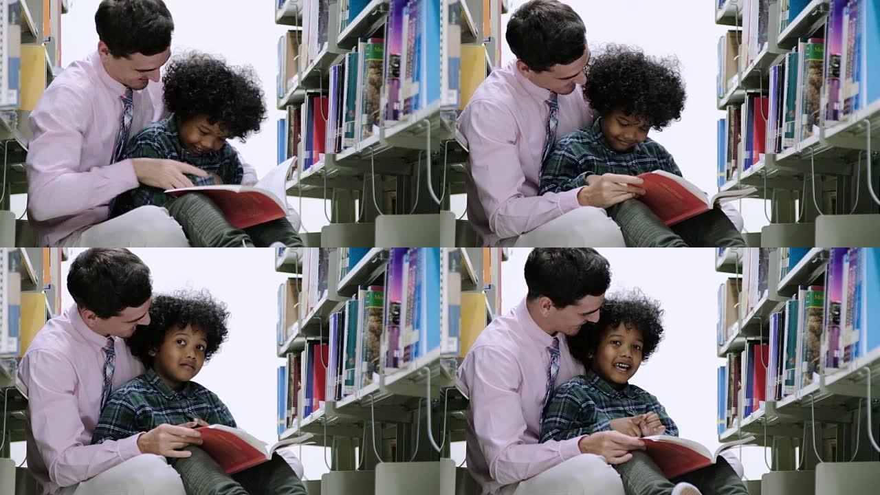 黑人小男孩学生和老师在图书馆读书。