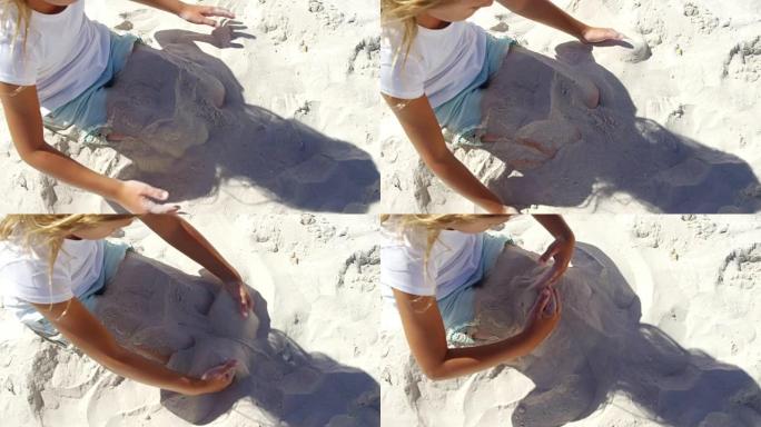 女孩在海滩玩沙子
