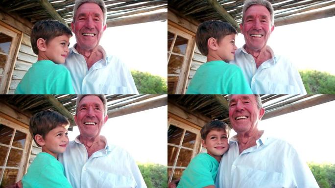 祖父和孙子在户外微笑拥抱