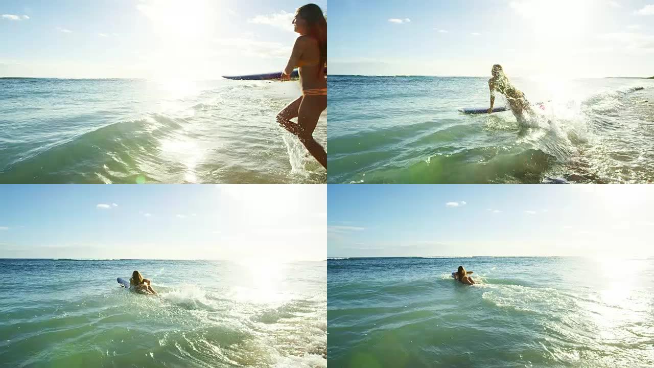 冲浪女孩跑进大海