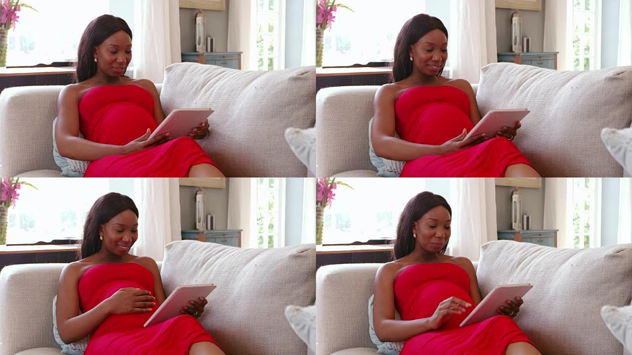 孕妇在沙发上使用数字平板电脑拍摄R3D