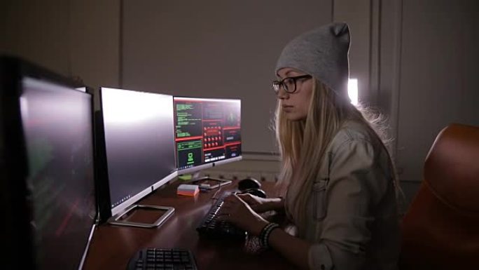 黑客女人在工作。计算机安全概念