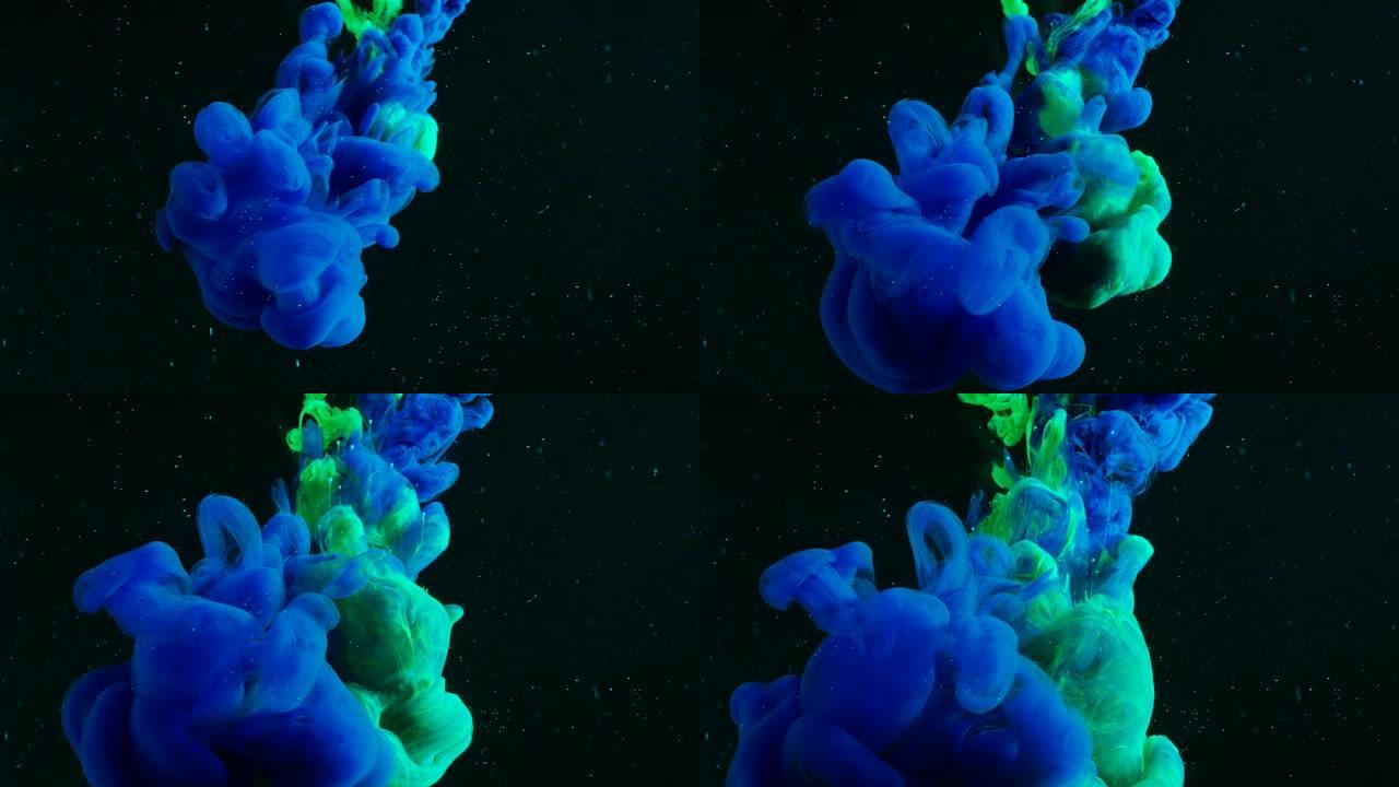 绿色和蓝色的油漆混合在充满黑水的油轮中，从而产生了精神转变形式。