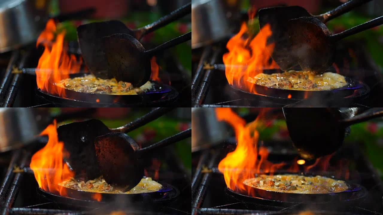FHD慢镜头特写烹饪炒虾用平底锅的铁锹炒，泰国传统食品，亚洲食品