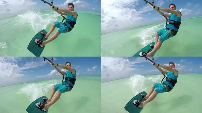 特写: 欢快的风筝冲浪者在桑给巴尔完美的绿松石海上放风筝
