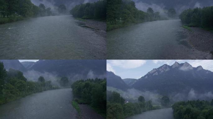 流动的河流被云杉森林环绕。背景中的山峰