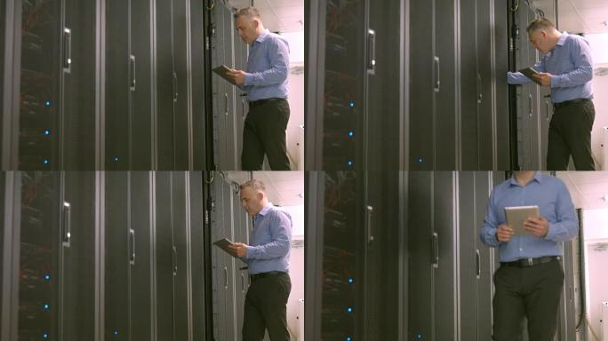 技术人员在分析服务器时使用平板电脑