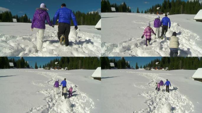 高清起重机: 一家人在雪地里行走