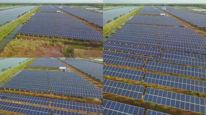 空中太阳能发电站或太阳能电池板在日落时分飞越东南亚当地道路和湖泊附近的拍摄和反射