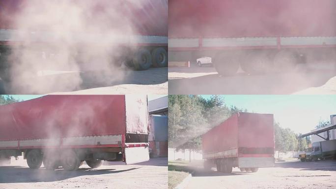 一辆红色货车向右转。空气中的尘埃云