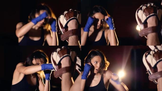 女拳击手击中焦点手套的特写镜头。4K