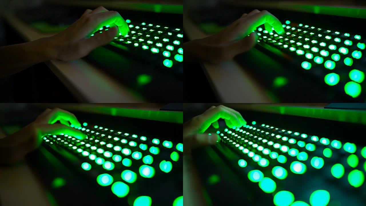 游戏中铜玩家手按下发光二极管绿色键盘按钮