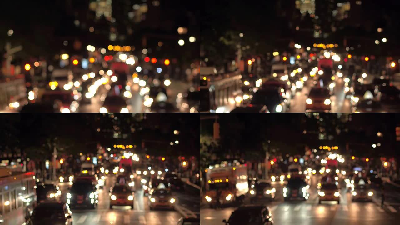 BOKEH: 夜间在繁忙的街道上抽动城市的灯光和模糊的交通信号灯