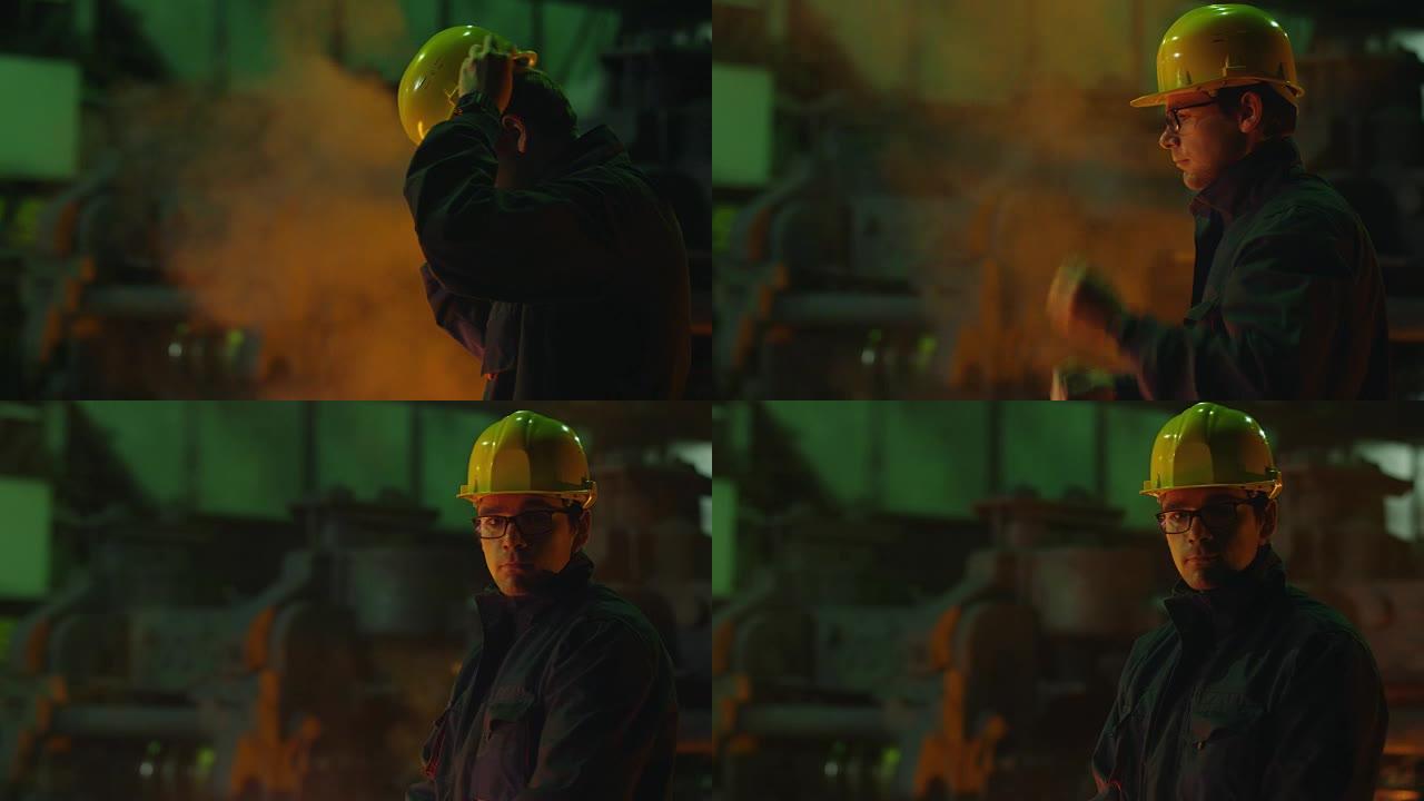 重工业技术员戴上安全帽的肖像。恶劣的工业环境。