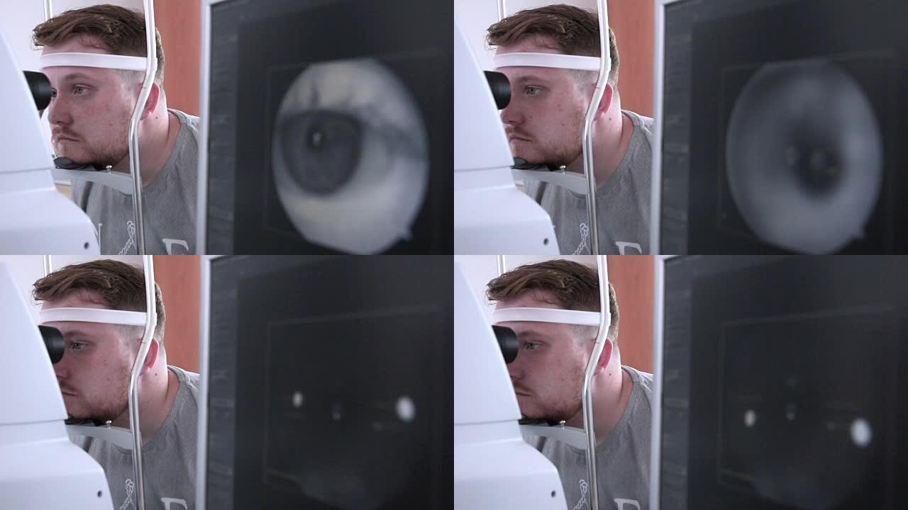男性患者进行眼科检查。在明亮的现代诊所的验光师就诊