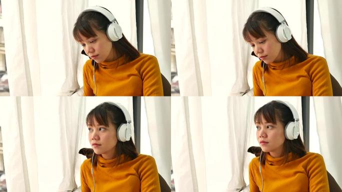 亚洲女性在家听音乐耳机