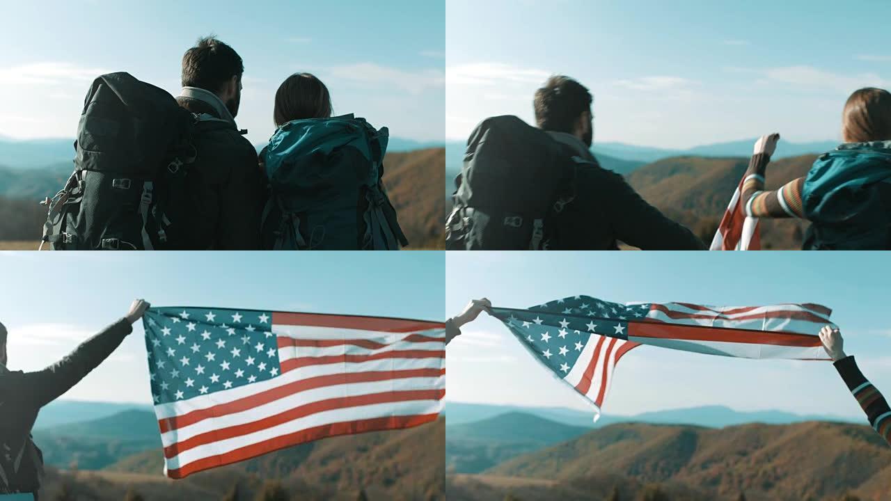 几个徒步旅行者在山顶的空中升起美国国旗