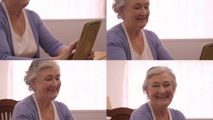 微笑的高级女性使用数字平板电脑