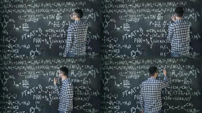 年轻的科学家在化学和数学方程式墙壁室内写塞克