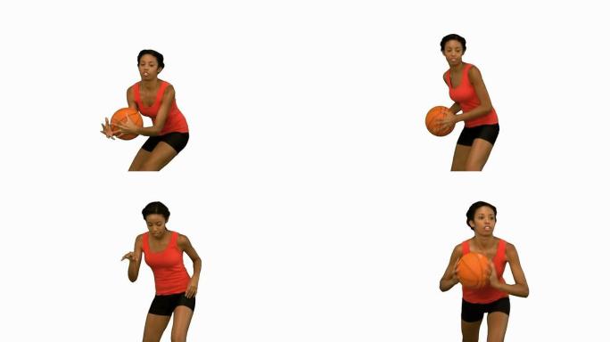女人在白色屏幕上接球并扔篮球