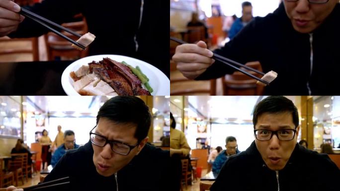 男人用筷子吃中国脆皮五花肉