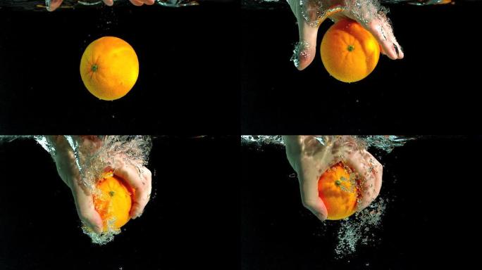 手从水中取出橙子