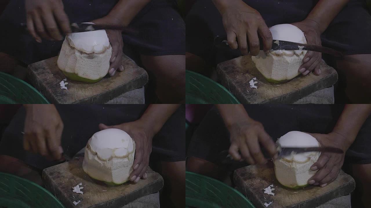 用刀切碎椰子的手